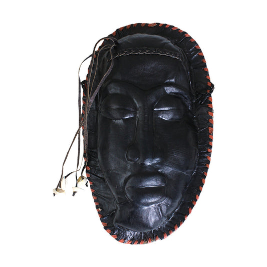 African mask with cowrie shells